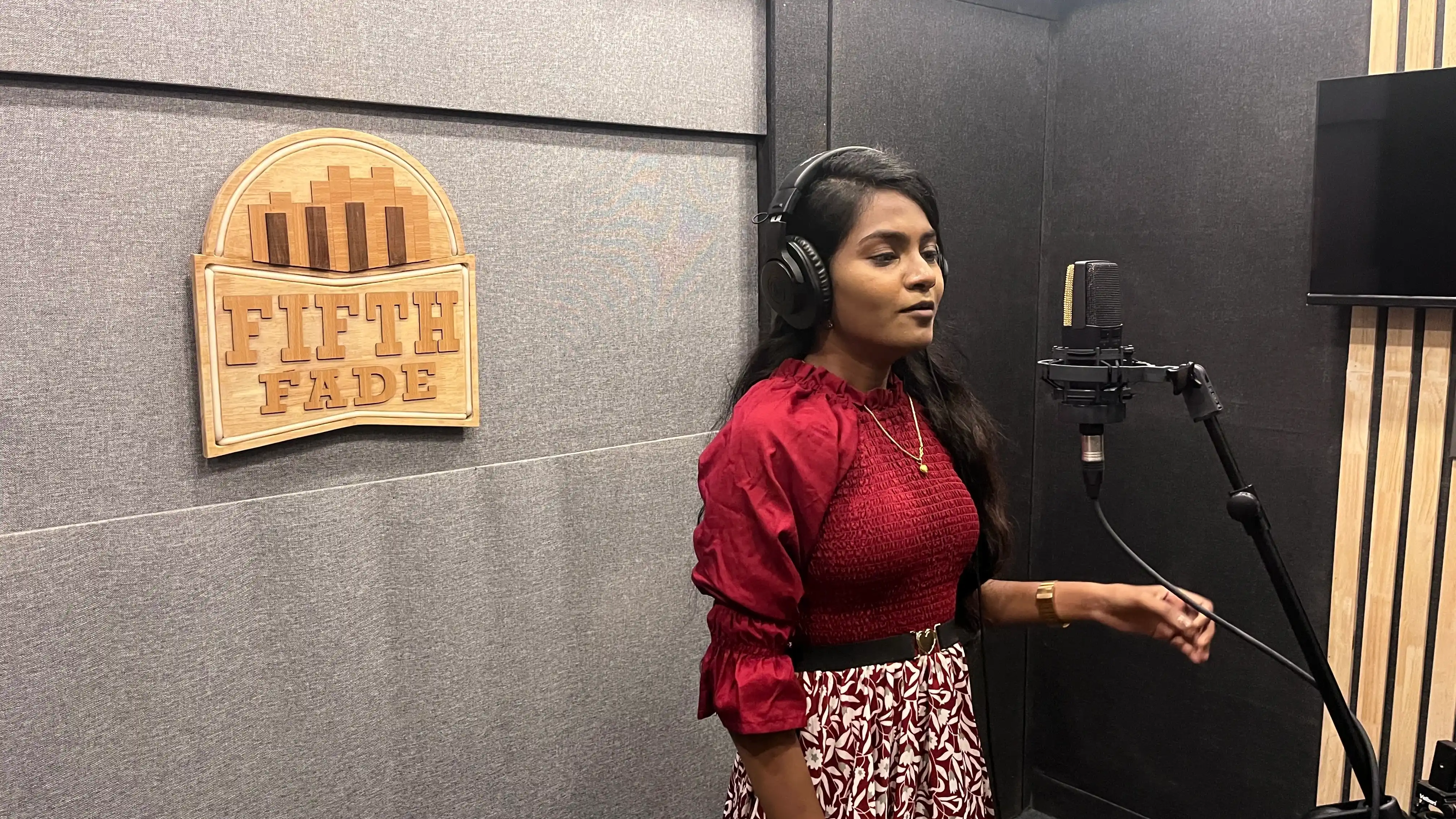 Condenser microphone with Fifth Fade wall sign
